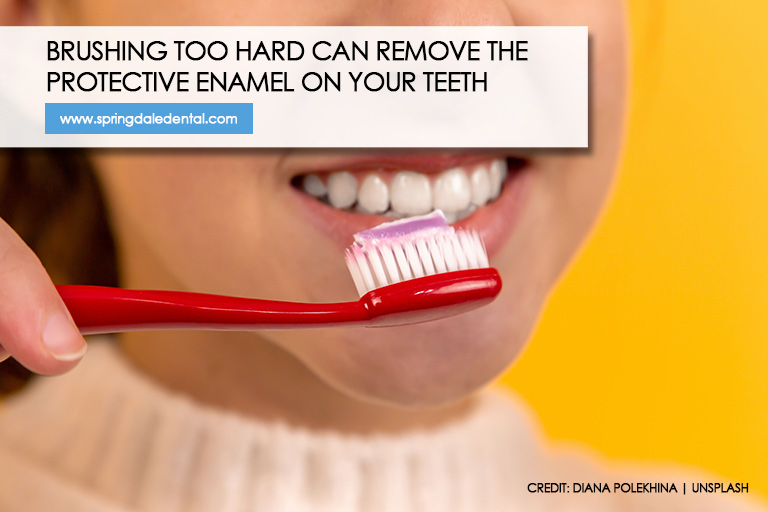 Brushing too hard can remove the protective enamel on your teeth