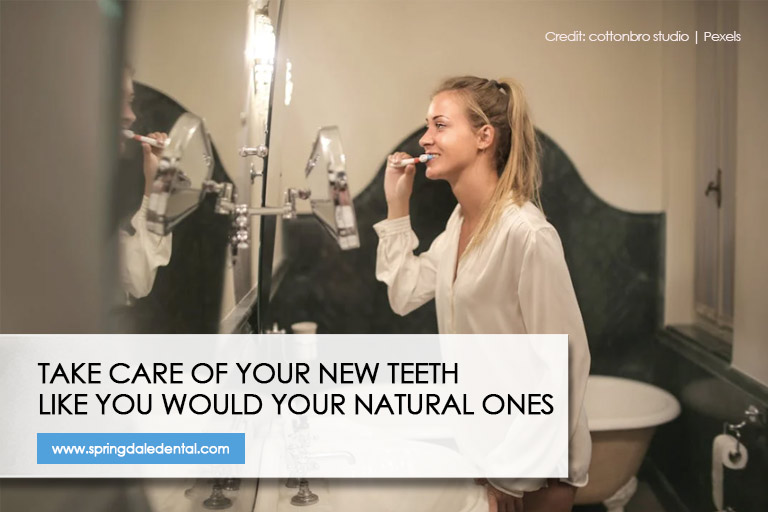 Take care of your new teeth like you would your natural ones